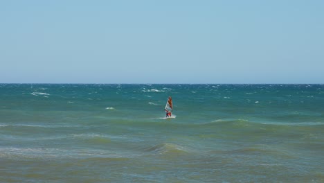 wind surfer passing by in slow motion