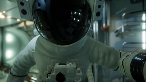 astronaut inside the orbital space station