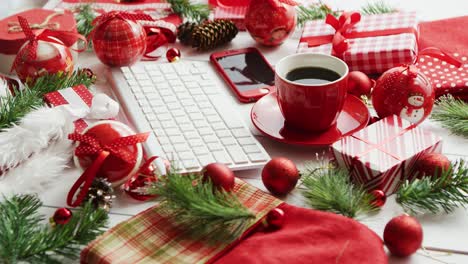 Christmas-symbols-around-devices-and-hot-beverage
