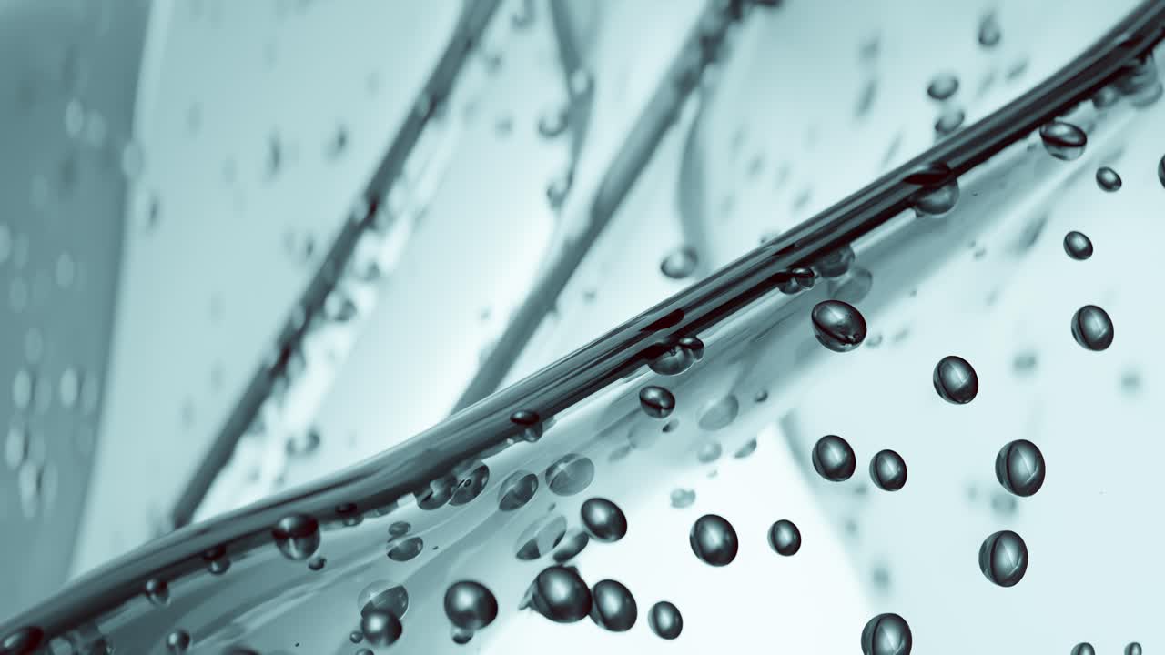 Close-up animation of bubbles moving through a viscous clear liquid