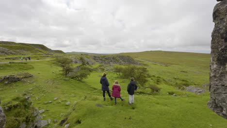 family hiking in a quarry landscape