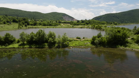 tkibuli lake reservoirs in georgia divided by grassy causeways