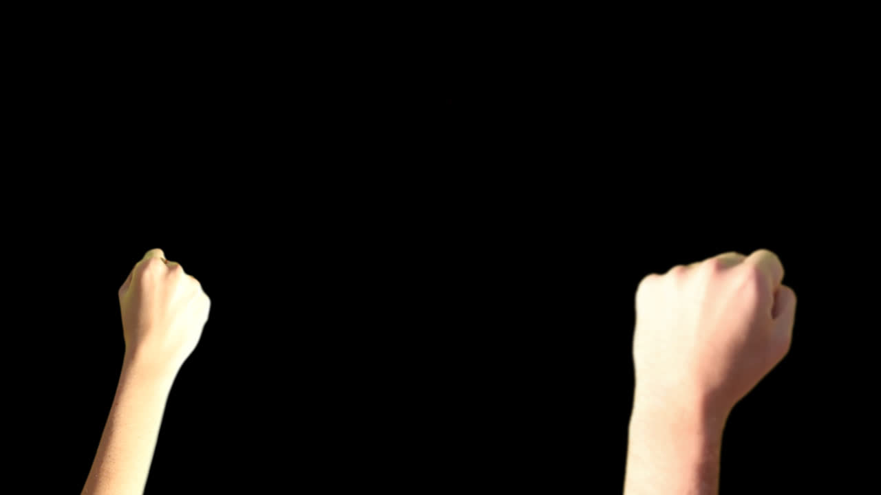 Isolated Clenched Fists Shaking on Black Background