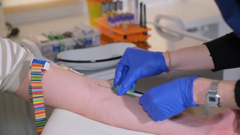 nurse in gloves taking blood from patient finger using glass slide in laboratory closeup 4k movie slow motion. complete blood count laboratory diagnostics