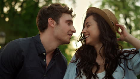 happy people walking in park at sunset. love couple laughing in park
