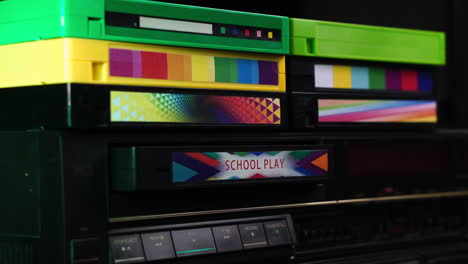 school play vhs video cassette tape ejecting from vcr, close up