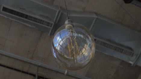 glass orb lamp hanging in the ceiling