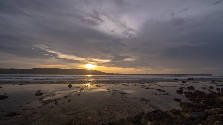 Sunset over a Rocky Coastal Landscape with Reflections