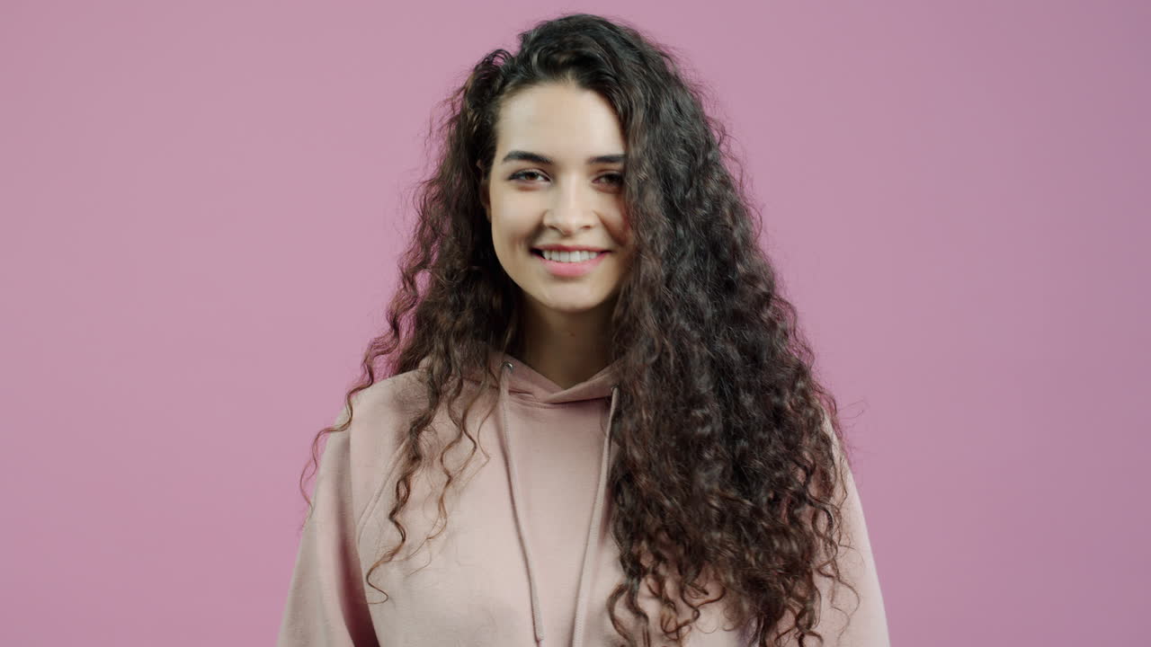 Woman with Curly Hair Pointing