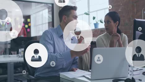 animation of digital icons over diverse business people in office