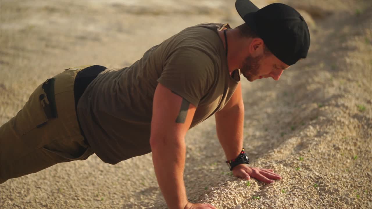 Man Doing Push-ups in the Desert