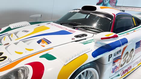 exhibition of retro racing cars of the porsche com 2023 11 27 04 51 25 utc.mov | automobile, automotive, background, building