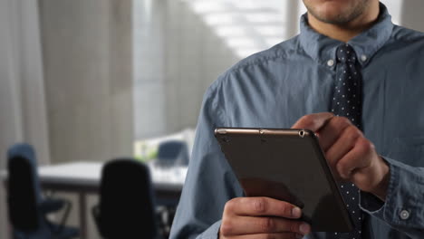Caucasian business man using a digital tablet