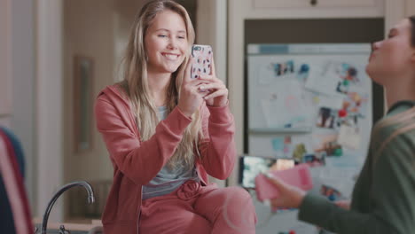 group-of-teenage-girls-taking-photos-using-smartphone-posing-enjoying-hanging-out-together-sharing-party-weekend-on-social-media