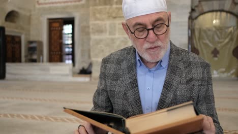 old man reading quran