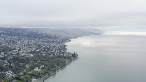 Drone-Aerial-of-the-beautiful-swiss-city-center-of-lausanne-located-on-the-lake-geneva-in-Switzerland-during-winter,-Europe