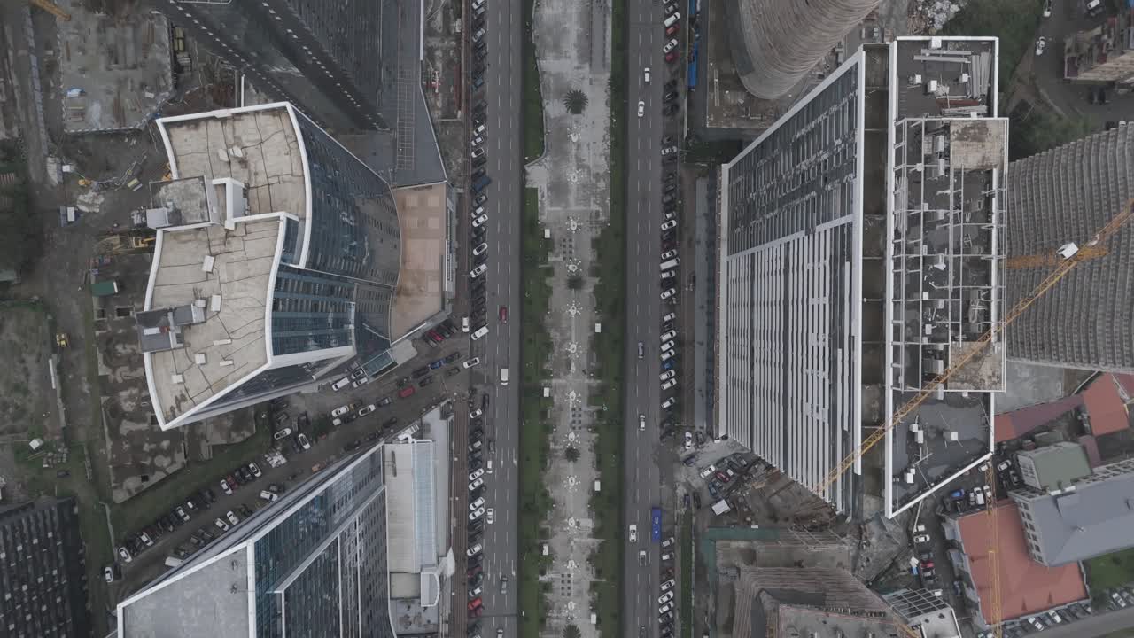 Cinematic daytime drone footage of Batumi traffic and tall buildings.