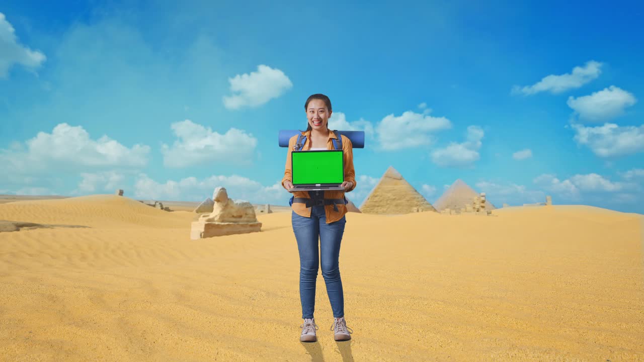 Woman with Laptop in Egyptian Desert