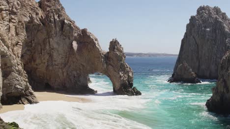 aerial drone shot of waves crashing on sea cliffs in cabo san lucas mexico-1