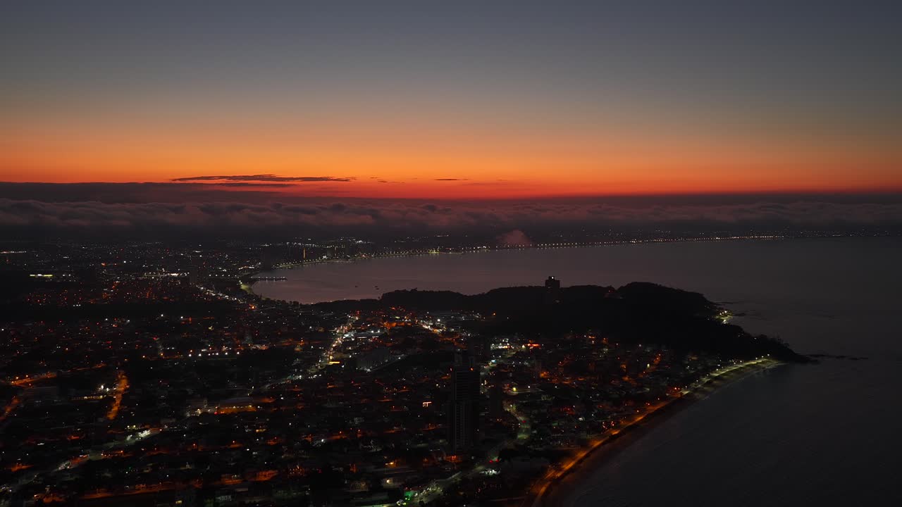 Amazing aerial fly over the Penha municipality with Balneario Picarras in dramatic sunset sky, Santa Catarina, Brazil