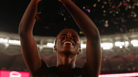 woman celebrating victory with trophy in stadium