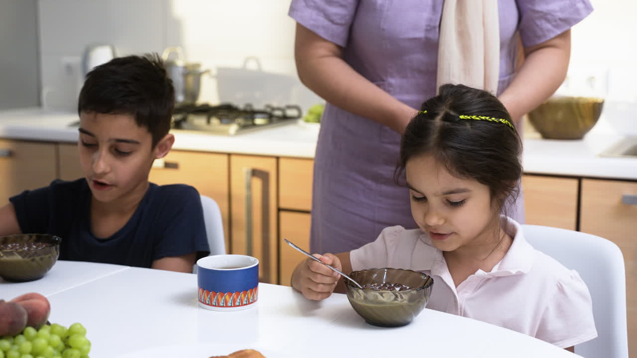 Islamic siblings having breakfast.