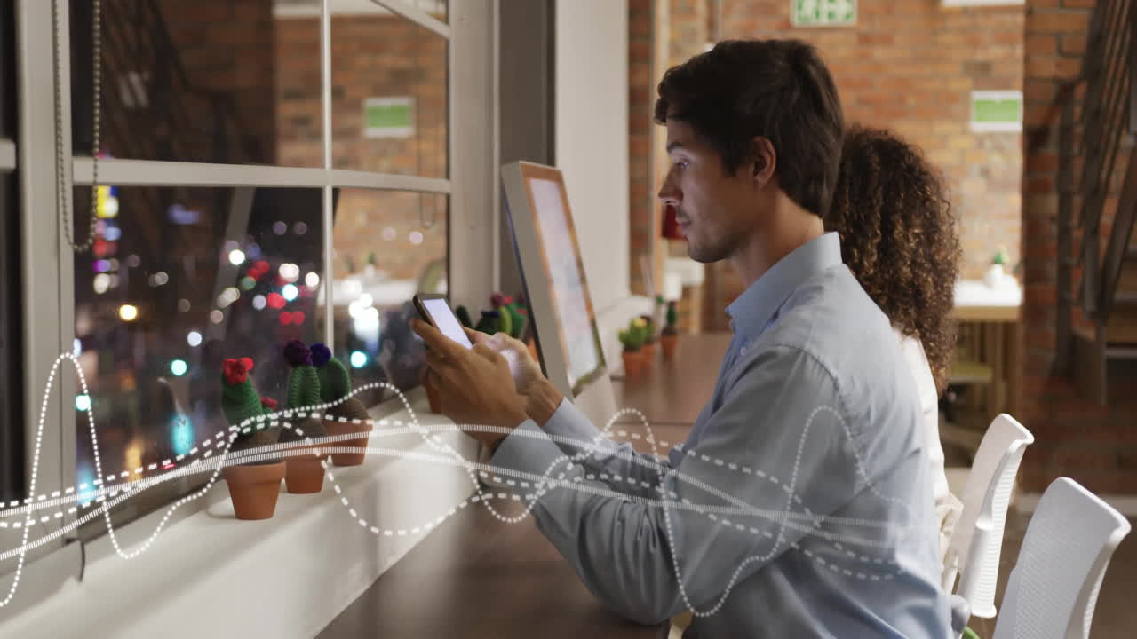 Animation of diagrams over diverse colleagues using smartphone in office
