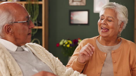 elderly couple in a conversation at home