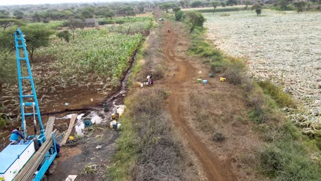 rig drilling water in rural village of kenya