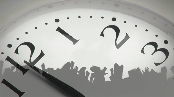 Animation of clock showing midnight and people dancing on white background