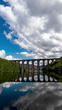 viaduct reflection on a calm lake