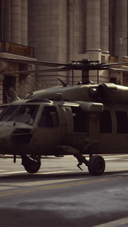 military helicopter landing in a city street