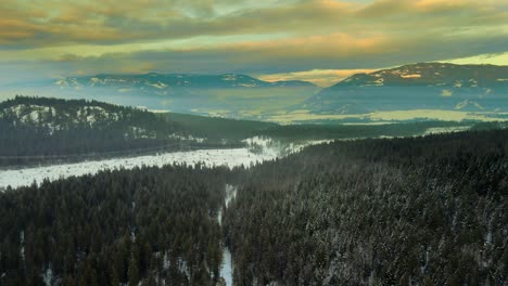 Stunning-Aerial-Footage-of-Winter-Landscape-with-Powerlines-Running-through-Snowy-Mountains