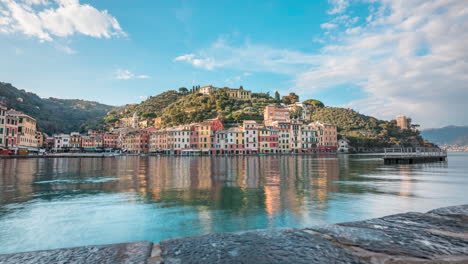 motion time lapse over harbor of picturesque sunny portofino as boat pulls in