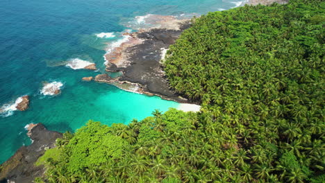 aerial tilt shot revealing the bateria beach on rolas island in sao tome, africa