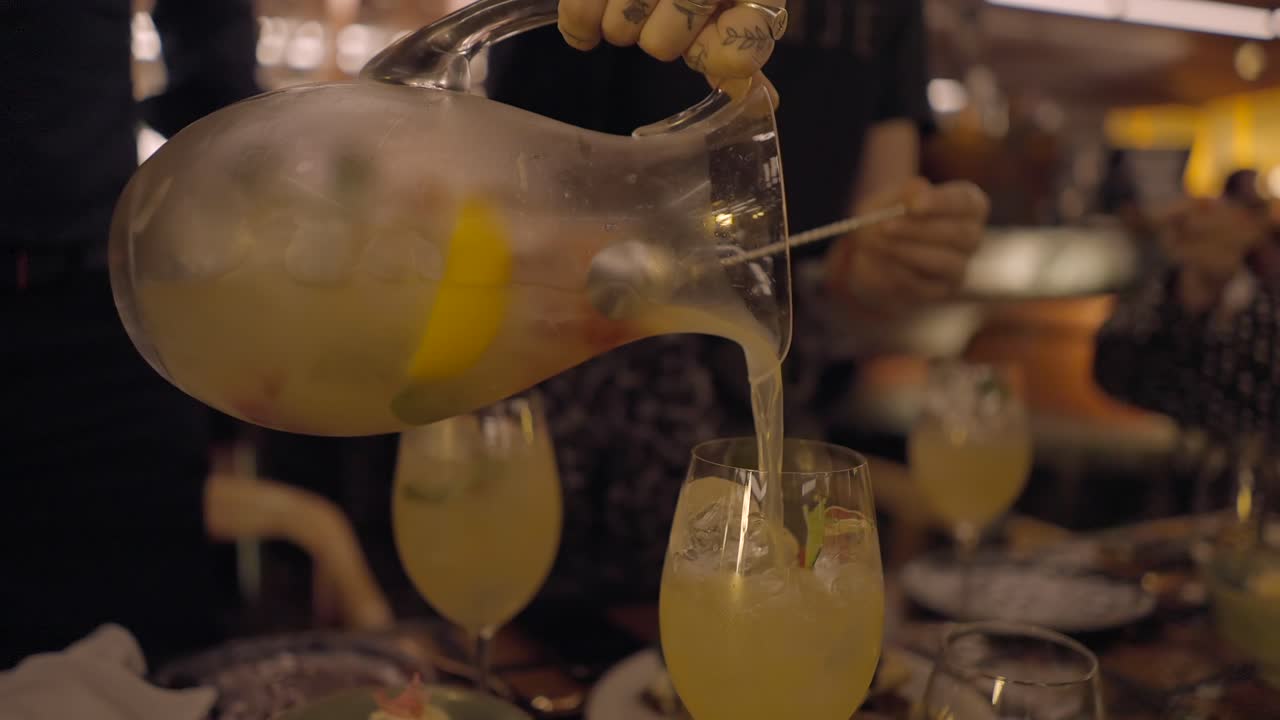 Pouring a refreshing cocktail