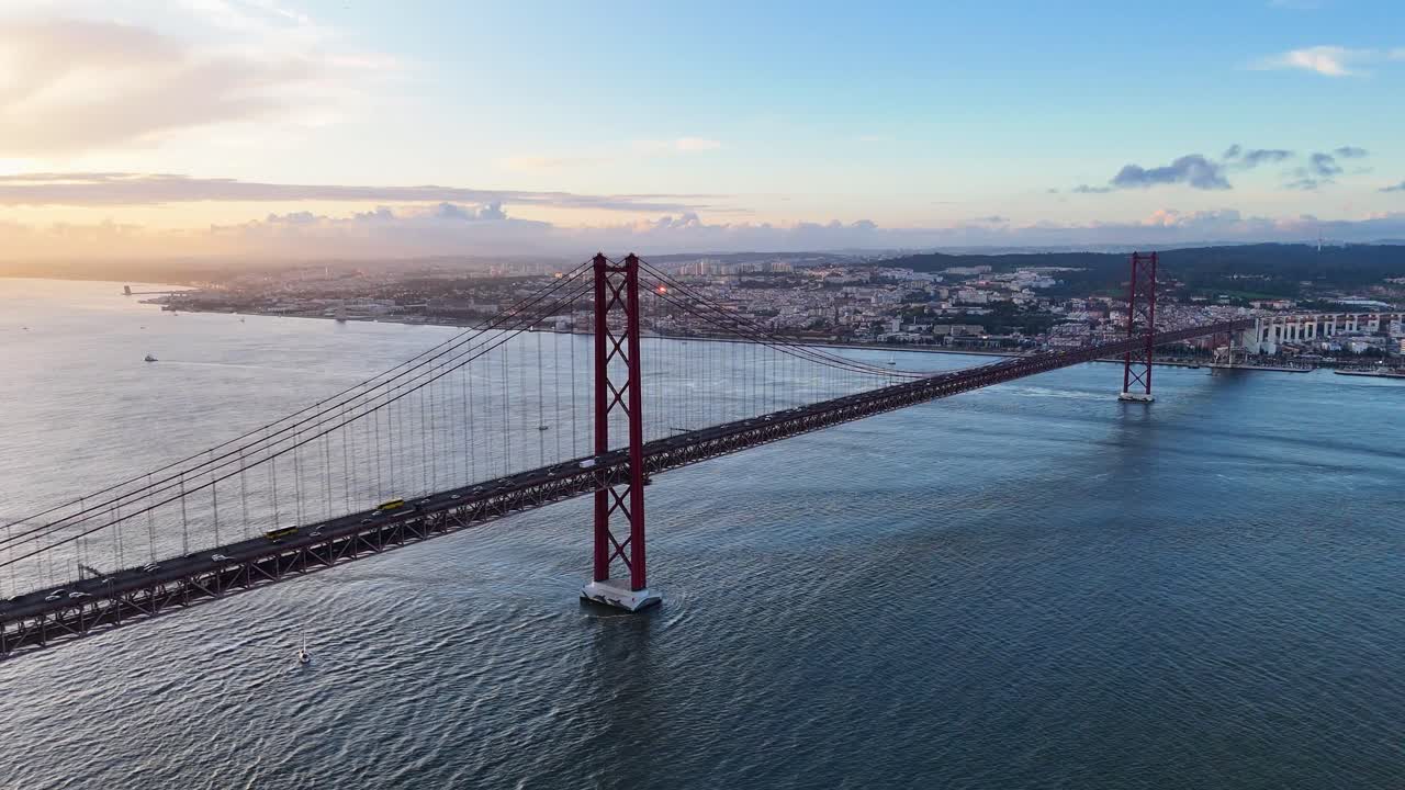 Lisbon’s iconic bridge over Tagus River during golden hour