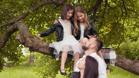 happy family playing in a tree