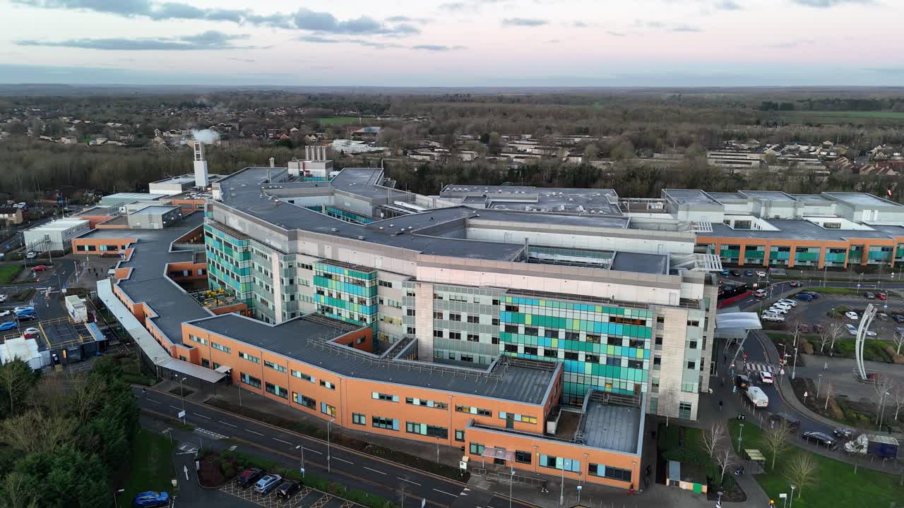 Peterborough city hospital UK pull back drone aerial reverse reveal