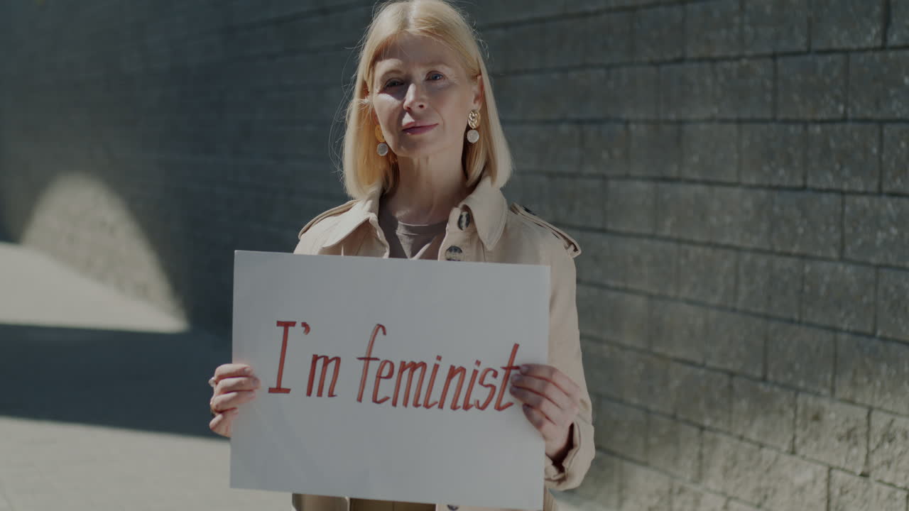 Woman holding a feminist sign