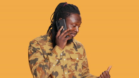 cool person with braids answering phone call on camera,