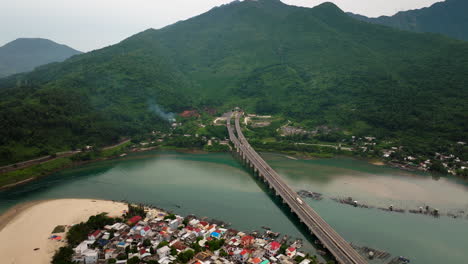 bridge over lang co bay toward hai van mountain tunnel in central vietnam, drone