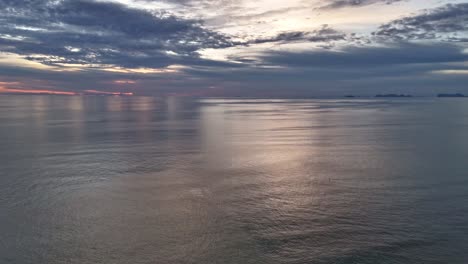 Aerial-hyperlapse-of-ocean-waves-crashing-on-Long-beach-Koh-Lanta-Thailand