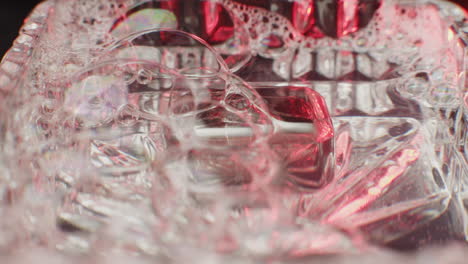 close-up of bubbles in water with red light