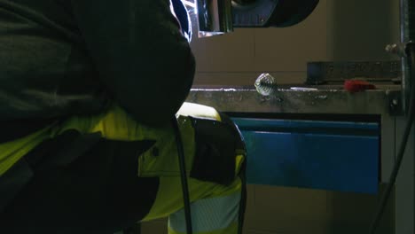 pan down shot of a man welding
