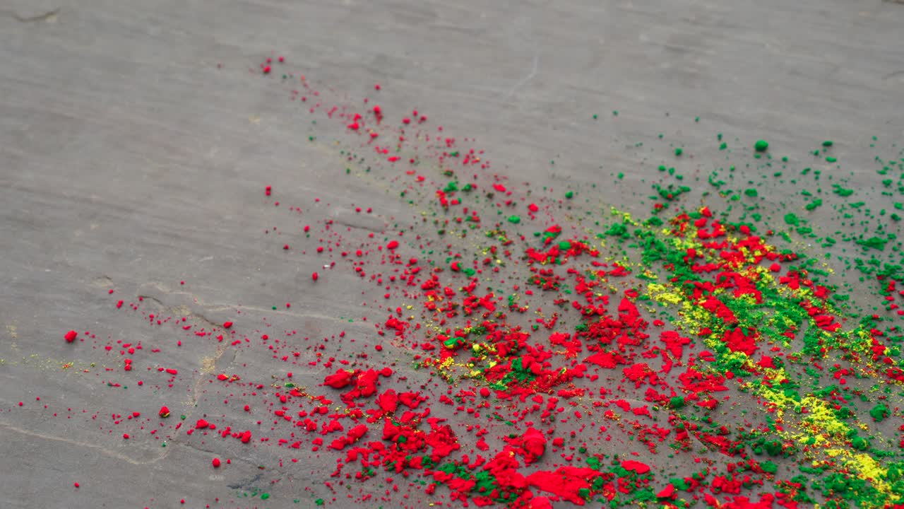 Herbal color dye or Gulal splashing on floor to celebration of Hindu festival Holi. Colors festival of Holi concept.