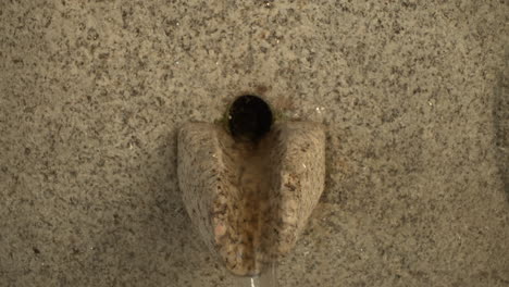 a water fountain made of granite