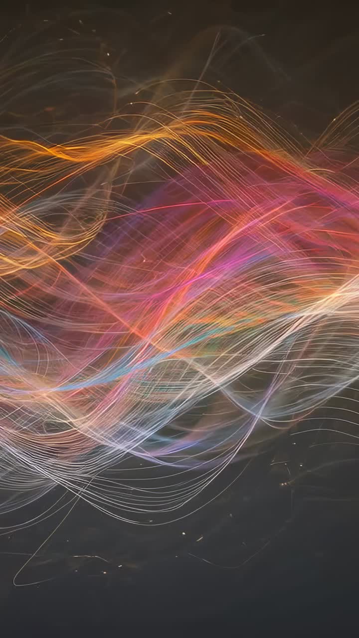 Vertical video: Flowing strands across dark canvas during play, with magenta band and orange crest