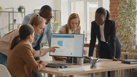 diverse business team collaborating on data analysis in office