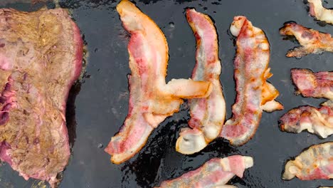 grilling steak and bacon on a blackstone griddle